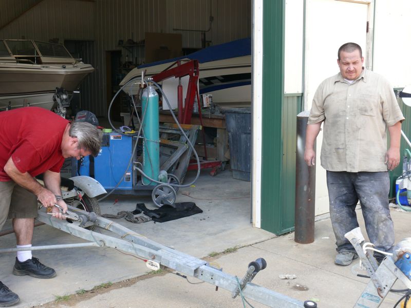 Jim (left) fixing the trailer